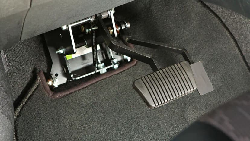 Instructor-side gas and brake pedal control