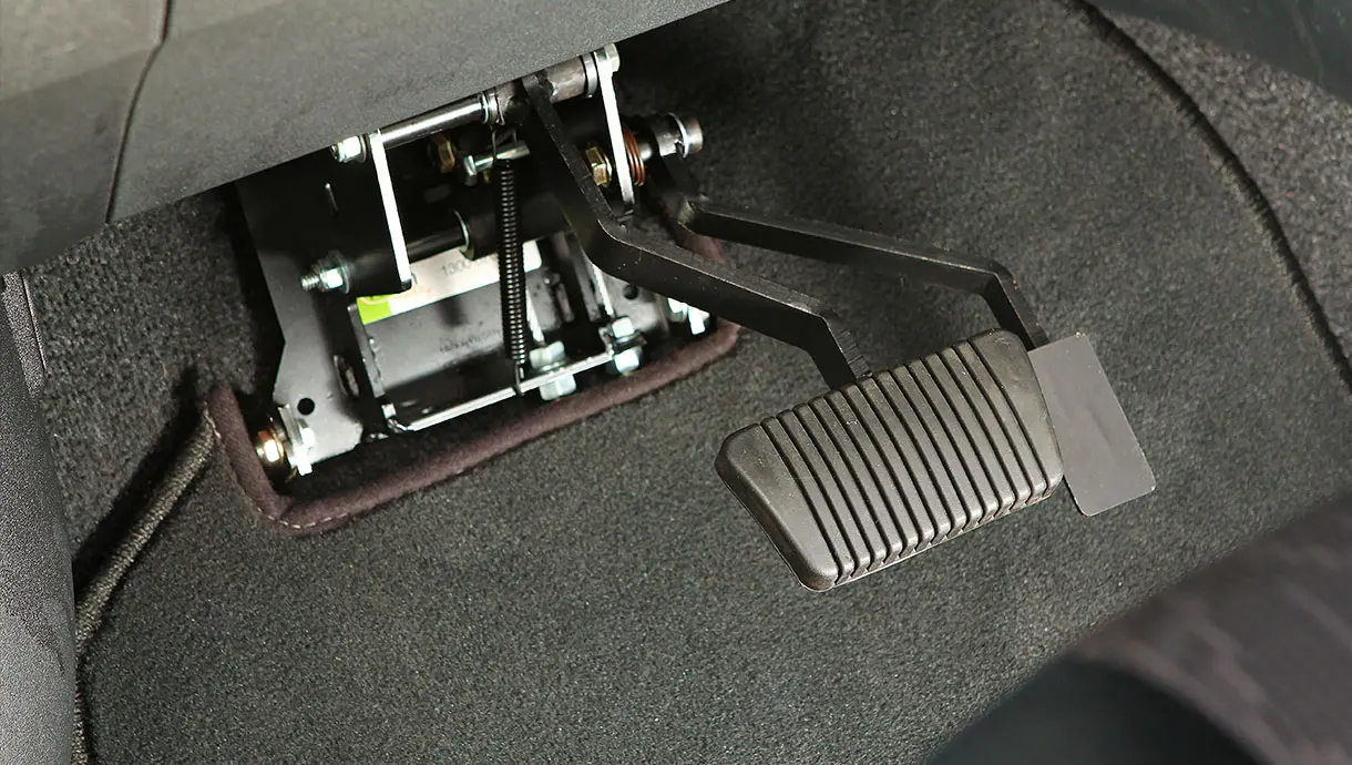 Instructor-side gas and brake pedal control